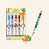Lifelines Scented Lava Gel Pens Classics display showing five clear gel pens with colorful flowing lava bubbles in blue, purple, red, green, and orange, plus scent labels for Mountain Air, Secret Garden, Spice Rush, Deep Woods, and Citrus Burst, with one green pen shown writing beside the package.
