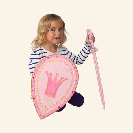 Child holding the Liontouch Queen Rosa Shield and a matching pink pretend-play sword to show scale and dress-up use.
