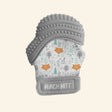 Malarkey Kids Munch Mitt shown in gray with a woodland animal print fabric mitten, textured gray silicone teething top, adjustable wrist strap, and soft mitten shape.