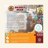 Back of MasterPieces Smokey Bear Poster 1000-piece jigsaw puzzle box showing Smokey Bear artwork, wildfire prevention story, product features, eco-friendly materials, and actual puzzle piece size.