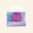 Mermaid Glitter 3D Eraser shown in a small clear peggable box, with a lavender eraser tucked inside a pink glitter mermaid tail holder and a blue glitter tail fin.