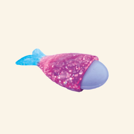 Mermaid Glitter 3D Eraser shown in a small clear peggable box, with a lavender eraser tucked inside a pink glitter mermaid tail holder and a blue glitter tail fin.
