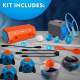 Science experiment kit with various components on a gray surface.