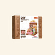 Rolife Sweetie’s Donut Shop shown in retail packaging with DIY miniature house branding, pastel donut shop artwork, and Super Creator Series box design.