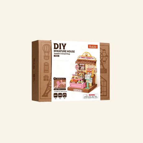 Rolife Sweetie’s Donut Shop shown in retail packaging with DIY miniature house branding, pastel donut shop artwork, and Super Creator Series box design.