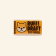 Ruff Draft Dog Eraser shown in its small orange-and-clear retail box with a cartoon dog face, “Ruff! Draft Dog Eraser” text, and Scentco branding on the side.