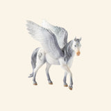 Schleich® BAYALA® Pegasus figure shown out of the box with white body, large feathered wings, silver mane and tail, and graceful winged horse detailing.