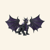 Schleich® ELDRADOR® Creatures Shadow Dragon shown from the front with wide black-and-purple wings, fierce face, sharp claws, and spiked fantasy creature details.