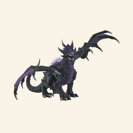 Schleich® ELDRADOR® Creatures Shadow Dragon shown from the side with raised wings, black body, purple chest, spiked back, and long dragon tail.