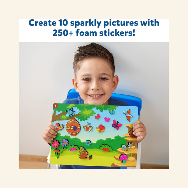 Child holding a completed Skillmatics Foil Fun – Bugs & Butterflies picture filled with colorful foil insects, flowers, mushrooms, and garden decorations.
