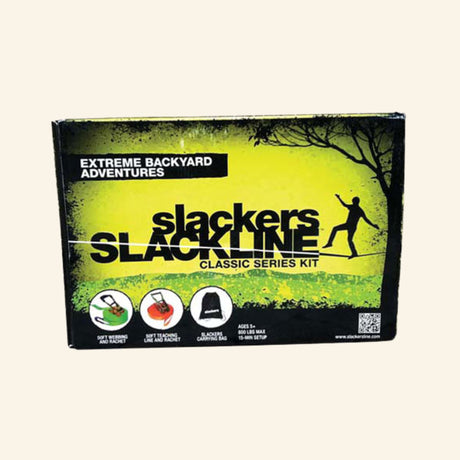 Slackers Classic Slackline Series Kit retail box showing the 50-foot slackline set, soft webbing and ratchet, teaching line and ratchet, carrying bag, age 5+ guidance, and backyard balance activity graphics.