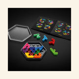 SmartGames IQ Deluxe: Hexagon game contents shown on a black surface, with the hexagon travel case, colorful puzzle pieces, challenge booklet, and partially completed puzzle board.