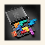 SmartGames IQ Flow open travel case shown on a dark background with colorful flow puzzle pieces placed on the black game board and the clear lid raised.