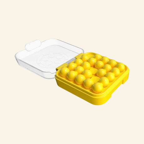 SmartGames IQ Mini yellow puzzle case shown open with the clear lid raised and yellow puzzle pieces arranged inside the compact board.