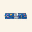 Snifty Cosmic Colored Pencil Box shown closed, featuring a vintage-inspired blue wooden box decorated with moons, suns, planets, stars, and shooting stars.