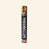 Snifty Kaleidoscope Jumbo Crayon – Neon shown upright in its black paper sleeve, with colorful confetti-style crayon pattern visible at the top and bottom.