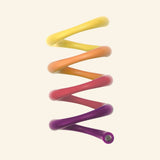 SPEKS 8 Helix Purple Plasma magnetic fidget coil featuring a flexible gradient-colored coil that shifts from yellow to orange, pink, and purple.