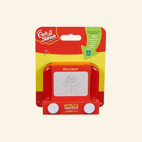 Spin Master Pocket Etch A Sketch shown in retail packaging with the classic red drawing toy, two white knobs, magic screen, World’s Favorite Drawing Toy badge, and recycled plastic callout.