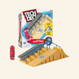 Spin Master Tech Deck Jump N’ Grind X-Connect Playset shown with retail box, modular skatepark ramps, stairs, blue rails, hubba ledge, and exclusive Toy Machine fingerboard.