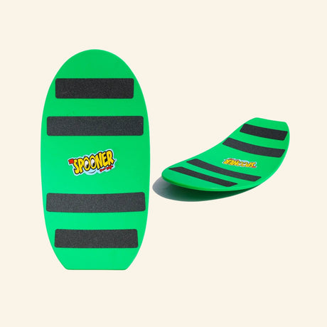 Green Spooner Freestyle Board shown flat and curved, featuring black traction strips, rounded board shape, and the Spooner logo in the center.