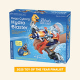 Thames & Kosmos Mega Cyborg Hydro Blaster retail box showing the buildable orange, blue, and gray wearable water blaster with claw, water stream graphics, 180-piece count, and 2025 Toy of the Year finalist badge.