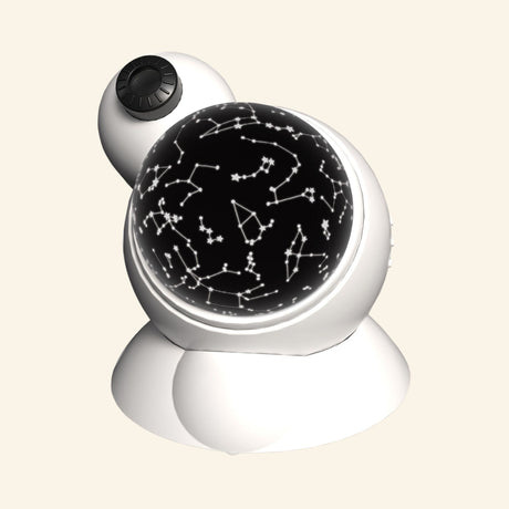 White Thames & Kosmos Planetarium Projector with a round black constellation dome on the front and a small projector lens on top.