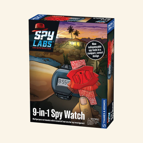 hames & Kosmos Spy Labs: 9-in-1 Spy Watch retail box showing a black digital spy watch with red decoder film, secret message paper, desert mission artwork, and “9-in-1 Spy Watch” text on the front.