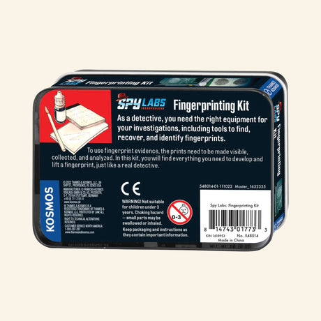Back of the Thames & Kosmos Spy Labs: Fingerprinting Kit metal tin showing the included fingerprint powder, brush, clear stickers, evidence card, product description, and UPC label.