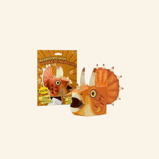 Triceratops Mask craft kit shown with orange packaging and a completed 3D paper triceratops mask featuring horns, a large frill, expressive eye, and open-mouth dinosaur design.