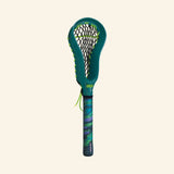 Front view of a single Waboba Urban LAX mini lacrosse stick showing the green head, black netting, blue-green handle, and small loose green string detail.